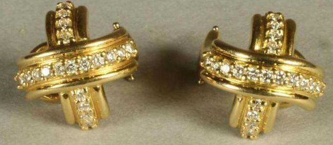 A PAIR OF TIFFANY & CO. DIAMOND SET 18CT GOLD STUD EARRINGS as domed reeded crosses point set with Image