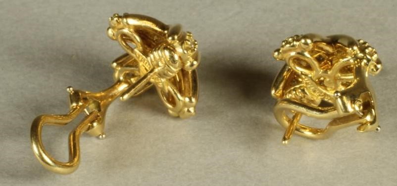 A PAIR OF TIFFANY & CO. DIAMOND SET 18CT GOLD STUD EARRINGS as domed reeded crosses point set with Image