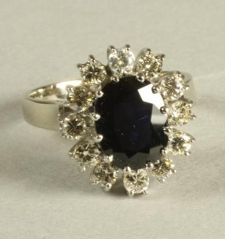 A SAPPHIRE AND DIAMOND CLUSTER RING Image