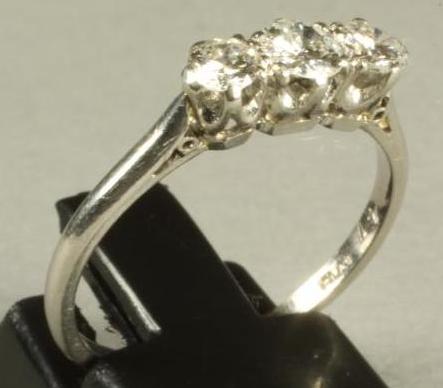A THREE STONE DIAMOND RING Image