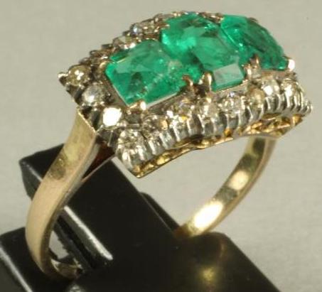 AN EMERALD AND DIAMOND RING Image