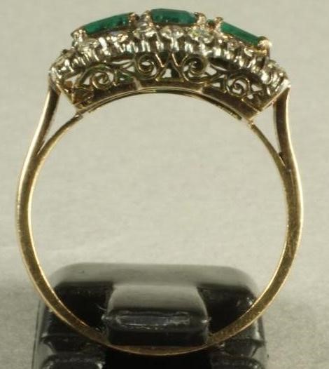 AN EMERALD AND DIAMOND RING Image