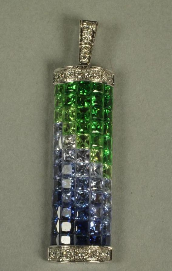 A SAPPHIRE AND EMERALD PENDANT Image