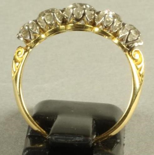 A FIVE STONE DIAMOND RING Image