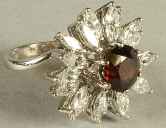 A GARNET AND DIAMOND COCKTAIL RING Image