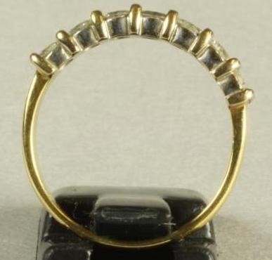 A SEVEN STONE DIAMOND HALF HOOP ETERNITY RING Image