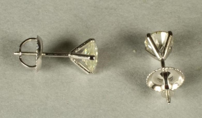 A PAIR OF DIAMOND EAR STUDS Image