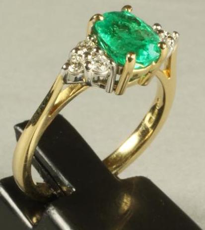 AN EMERALD AND DIAMOND RING Image