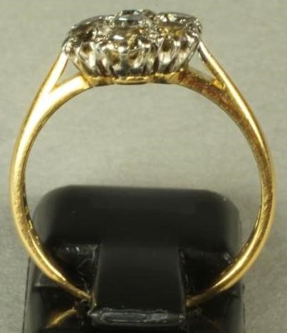 A SEVEN STONE DIAMOND CLUSTER RING Image