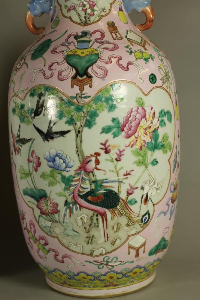 A PAIR OF CHINESE PORCELAIN VASES of rounded cylindrical form with elephant mask handles Image