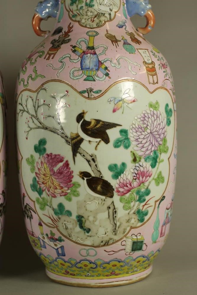 A PAIR OF CHINESE PORCELAIN VASES of rounded cylindrical form with elephant mask handles Image