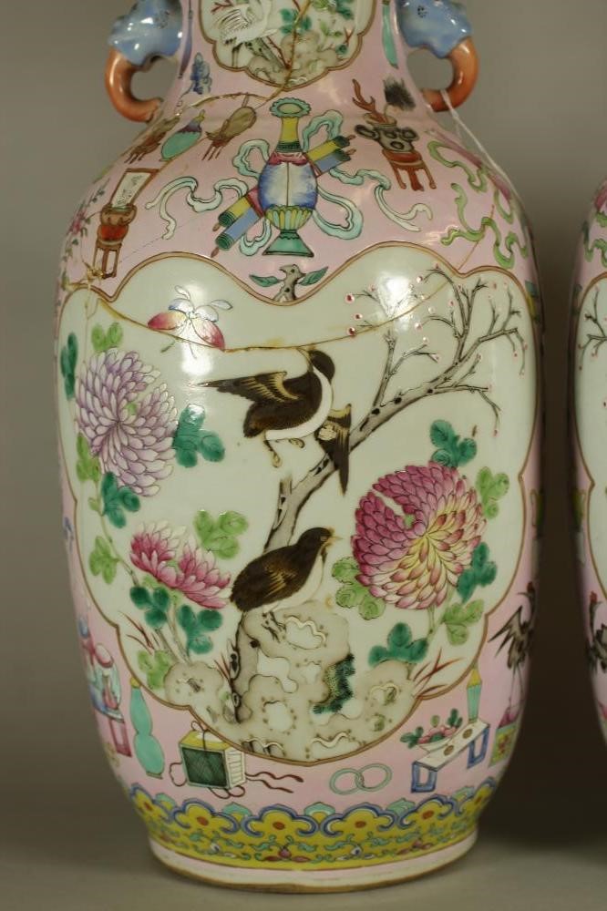 A PAIR OF CHINESE PORCELAIN VASES of rounded cylindrical form with elephant mask handles Image
