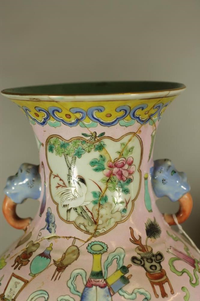 A PAIR OF CHINESE PORCELAIN VASES of rounded cylindrical form with elephant mask handles Image