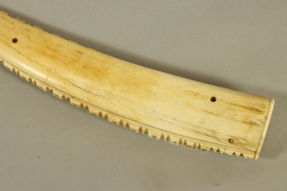 A WALRUS TUSK SCRIMSHAW CRIBBAGE BOARD Image