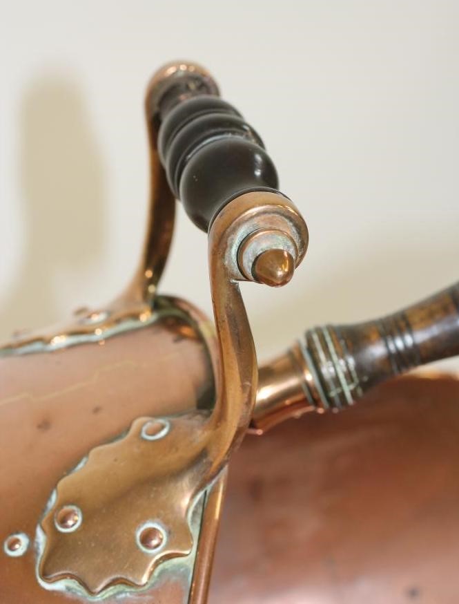 A VICTORIAN COPPER COAL SCUTTLE of helmet form Image
