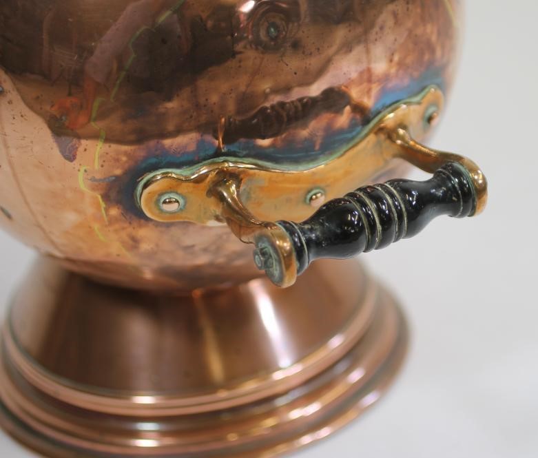 A VICTORIAN COPPER COAL SCUTTLE of helmet form Image