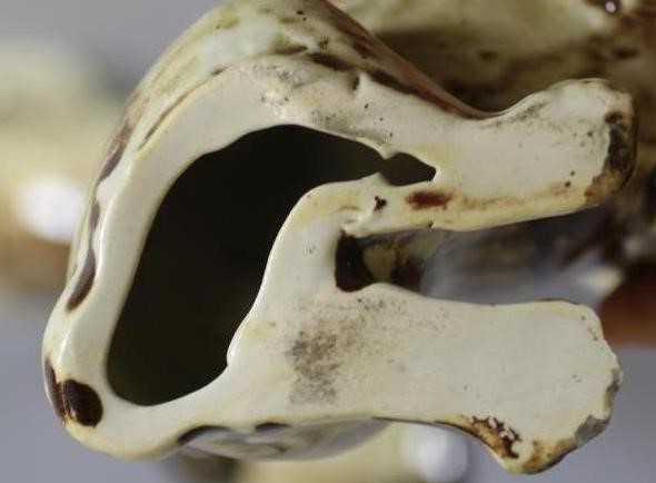 A MATCHED PAIR OF CONTINENTAL CREAMWARE SLIP CAST MODELS OF PUGS Image