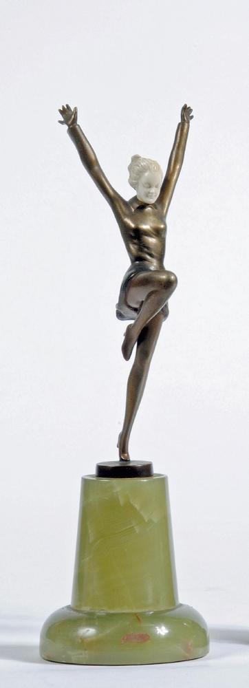 AN ART DECO BRONZE FIGURE OF A YOUNG FEMALE with carved ivory head Image