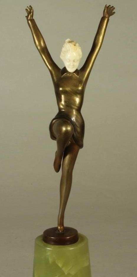 AN ART DECO BRONZE FIGURE OF A YOUNG FEMALE with carved ivory head Image