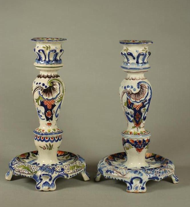 A COMPOSITE PAIR OF FRENCH FAIENCE CANDLESTICKS Image