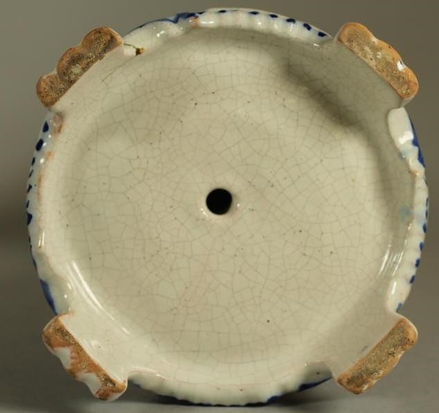 A COMPOSITE PAIR OF FRENCH FAIENCE CANDLESTICKS Image