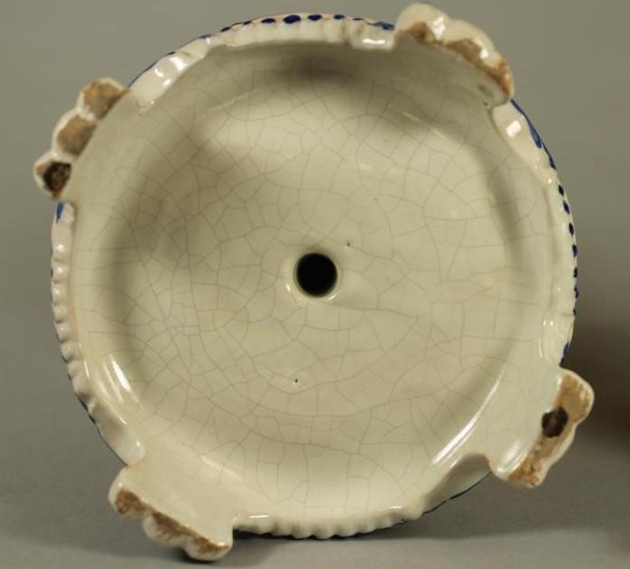 A COMPOSITE PAIR OF FRENCH FAIENCE CANDLESTICKS Image