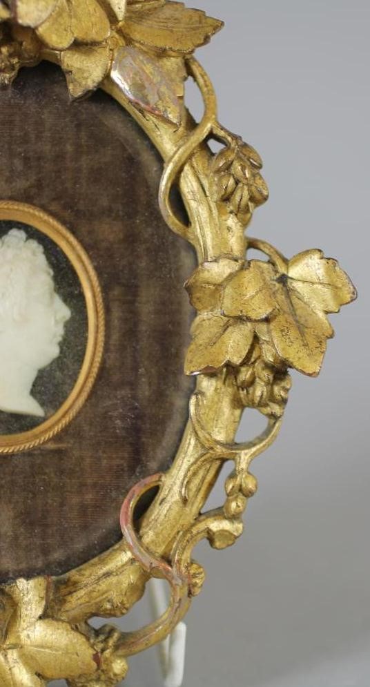 A EUROPEAN CARVED IVORY HEAD PORTRAIT PLAQUE Image