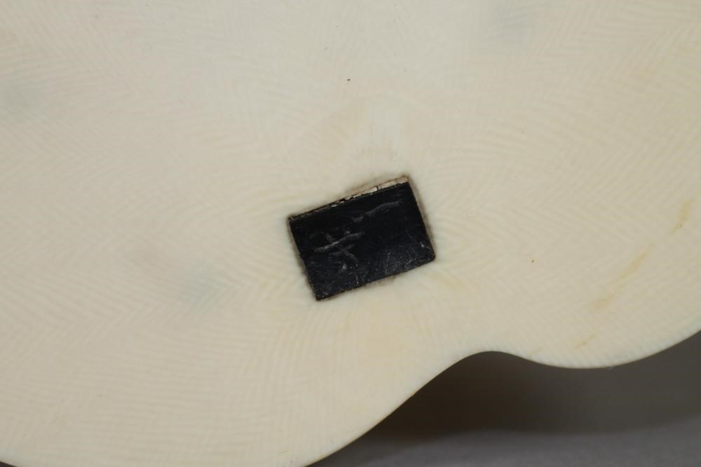 A JAPANESE SECTIONAL IVORY OKIMONO Image