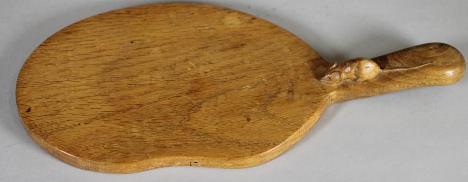 A ROBERT THOMPSON ADZED OAK CHEESEBOARD Image