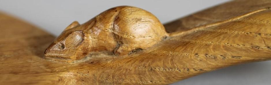 A ROBERT THOMPSON ADZED OAK CHEESEBOARD Image