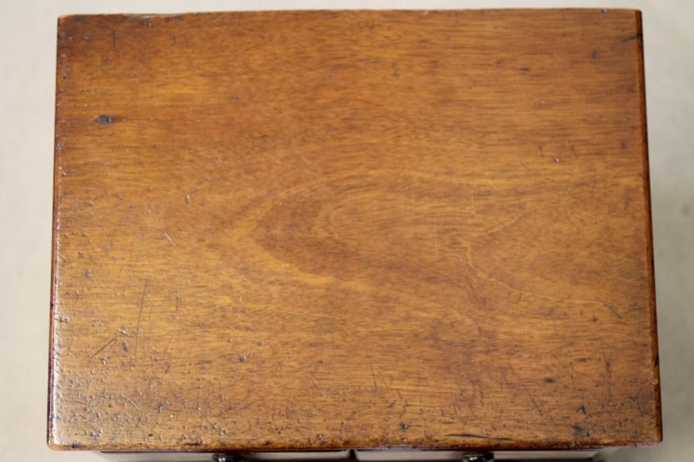 A VICTORIAN MAHOGANY MINIATURE CHEST of two short and three long drawers with turned wood handles Image
