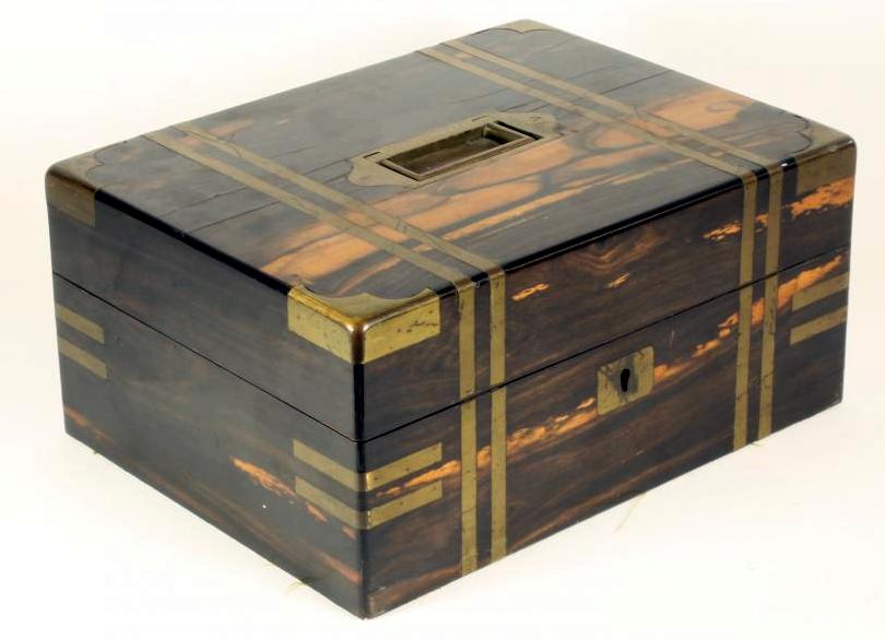 AN EARLY VICTORIAN COROMANDEL TRAVELLING DRESSING BOX of plain oblong form with inlaid brass Image