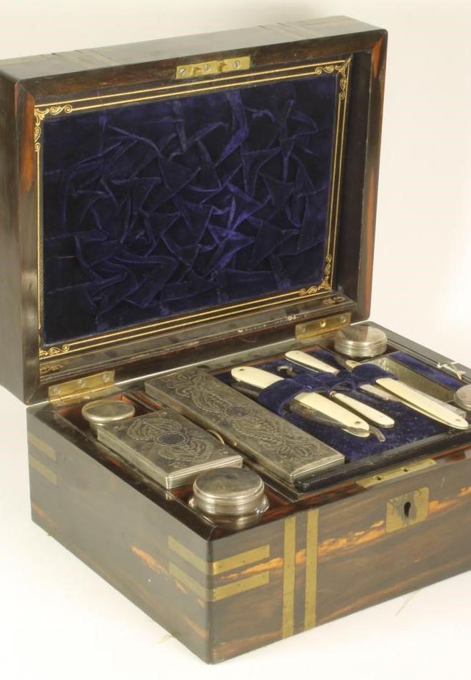 AN EARLY VICTORIAN COROMANDEL TRAVELLING DRESSING BOX of plain oblong form with inlaid brass Image