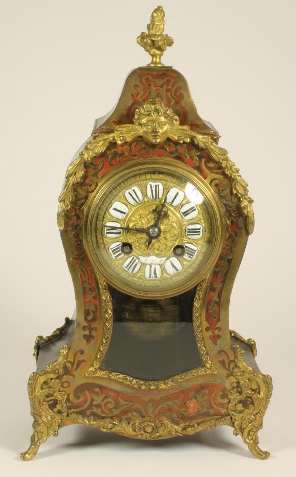 A FRENCH LOUIS XV STYLE STRIKING MANTEL CLOCK Image