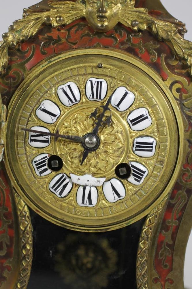 A FRENCH LOUIS XV STYLE STRIKING MANTEL CLOCK Image