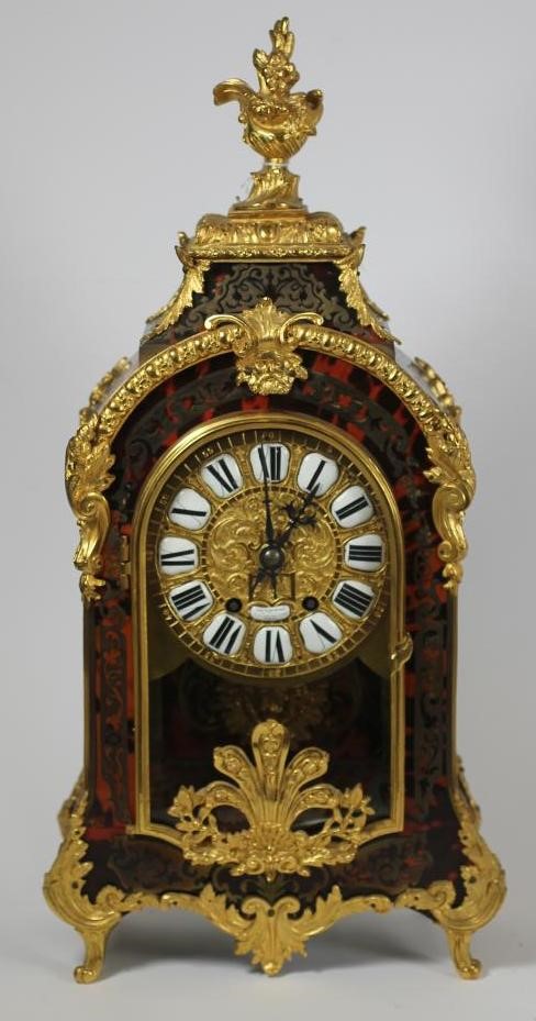 A FRENCH LOUIS XV STYLE RED BOULLE AND GILT METAL MANTEL CLOCK Image