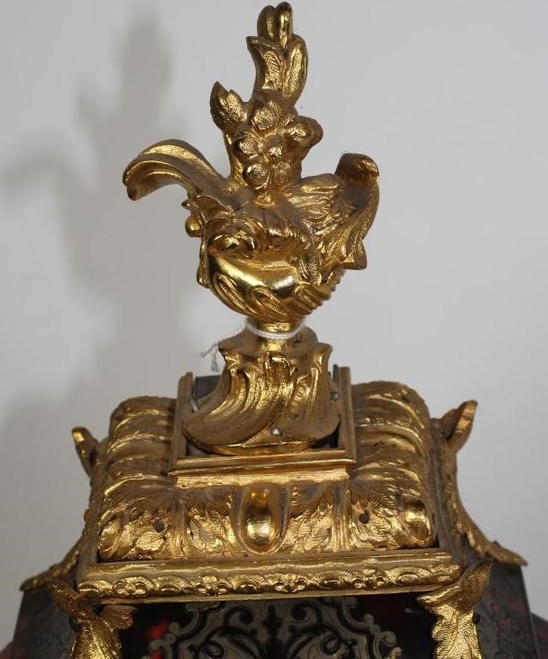 A FRENCH LOUIS XV STYLE RED BOULLE AND GILT METAL MANTEL CLOCK Image