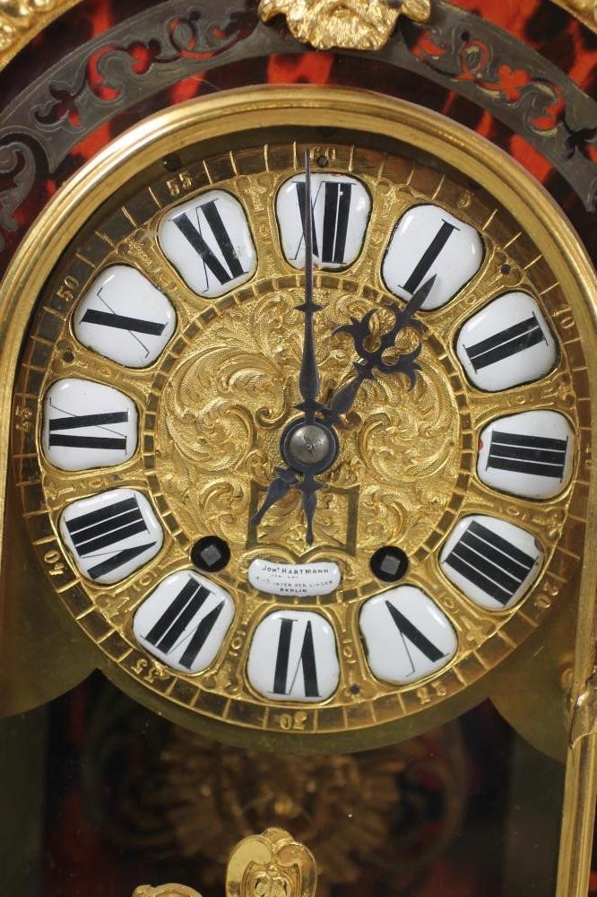 A FRENCH LOUIS XV STYLE RED BOULLE AND GILT METAL MANTEL CLOCK Image