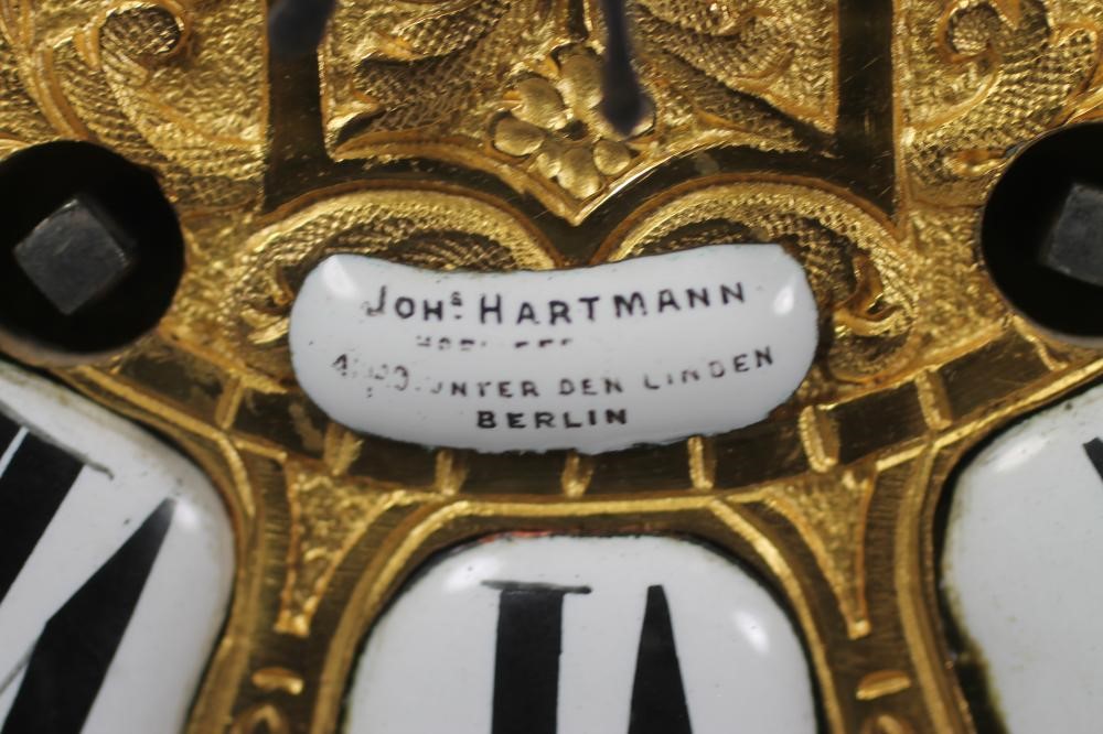 A FRENCH LOUIS XV STYLE RED BOULLE AND GILT METAL MANTEL CLOCK Image