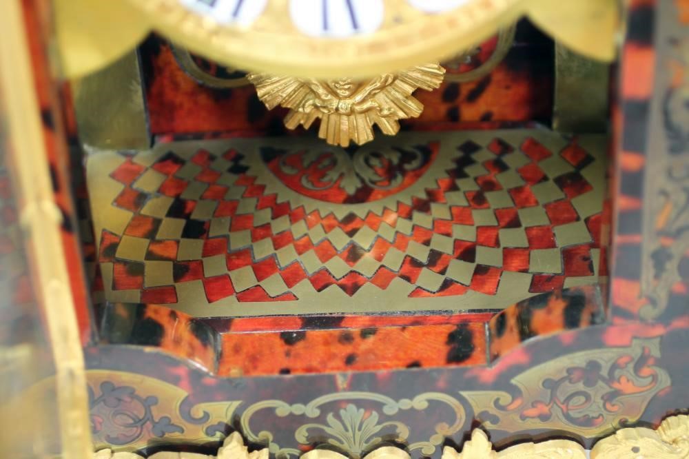 A FRENCH LOUIS XV STYLE RED BOULLE AND GILT METAL MANTEL CLOCK Image