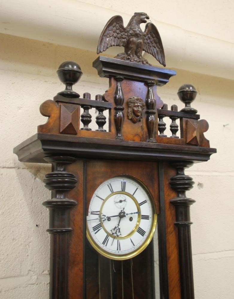 A WALNUT CASED VIENNA TYPE WALL CLOCK Image