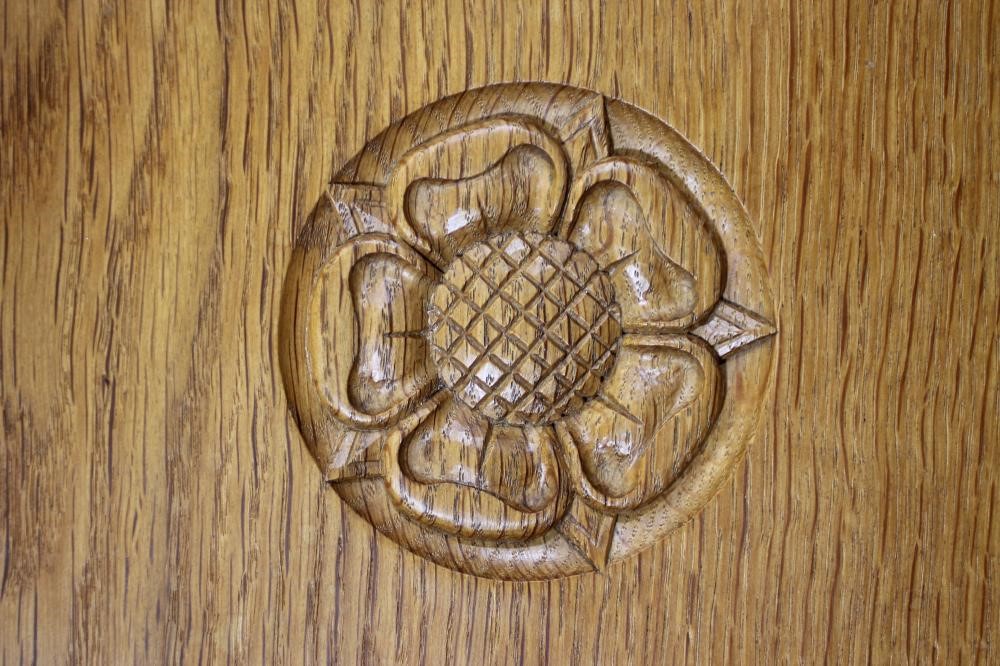 A MALCOLM PIPES ADZED OAK DINING SUITE comprising gateleg table Image