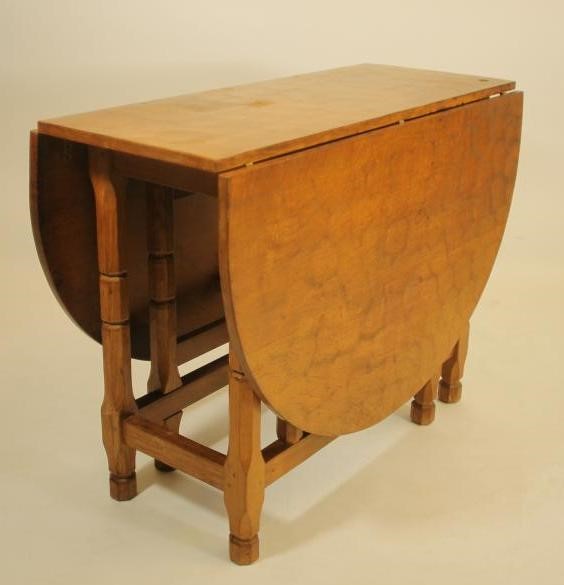 A MALCOLM PIPES ADZED OAK DINING SUITE comprising gateleg table Image