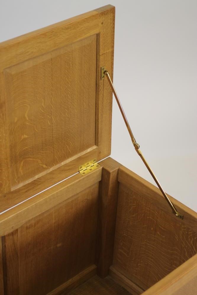 A MALCOLM PIPES ADZED OAK PANELLED COFFER Image