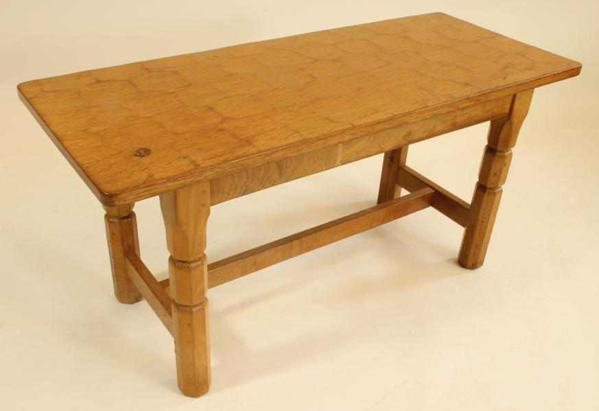 A MALCOLM PIPES ADZED OAK COFFEE TABLE of rounded oblong form with plain frieze Image