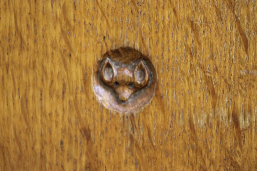 A MALCOLM PIPES ADZED OAK COFFEE TABLE of rounded oblong form with plain frieze Image
