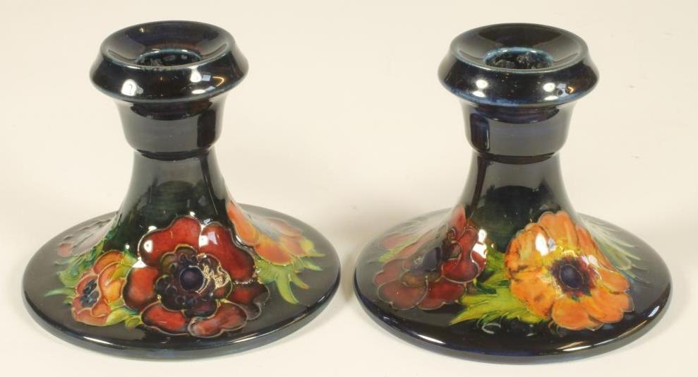 A PAIR OF MOORCROFT POTTERY DWARF CANDLESTICKS Image