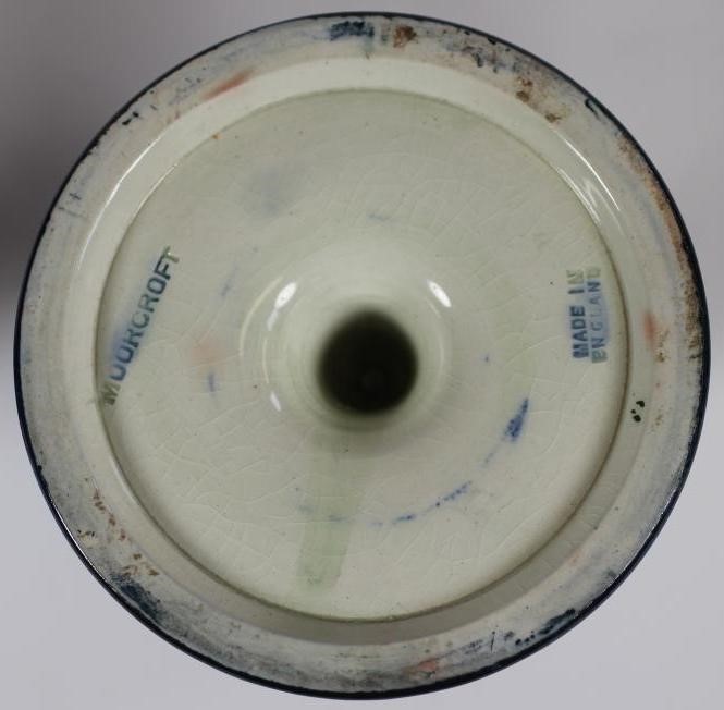 A PAIR OF MOORCROFT POTTERY DWARF CANDLESTICKS Image