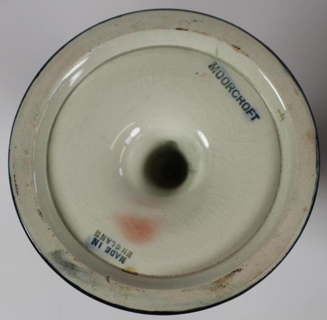 A PAIR OF MOORCROFT POTTERY DWARF CANDLESTICKS Image