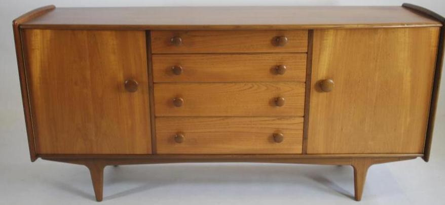 A TEAK LOW SIDEBOARD by A. Younger Ltd. Image